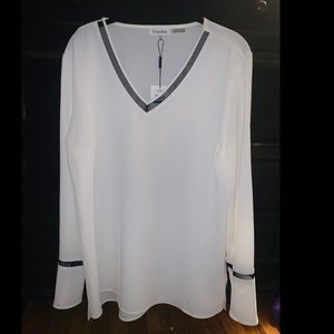 Calvin Klein women’s flutter sleeve blouse.